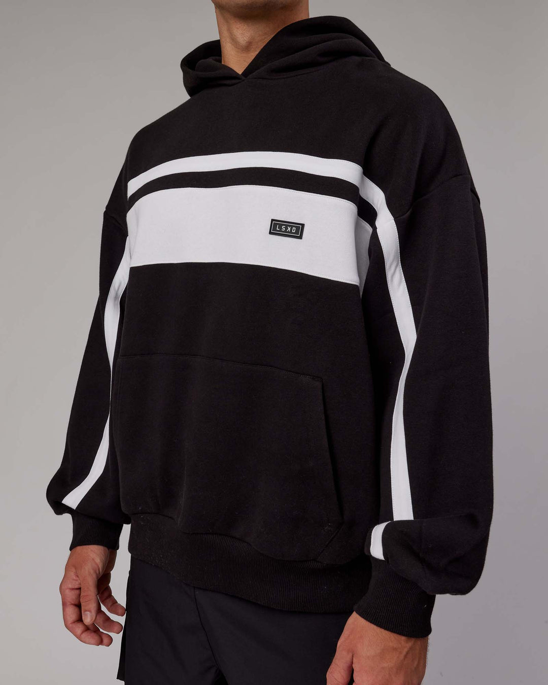 Man wearing Unisex Intercept Hoodie Oversize - Black-White