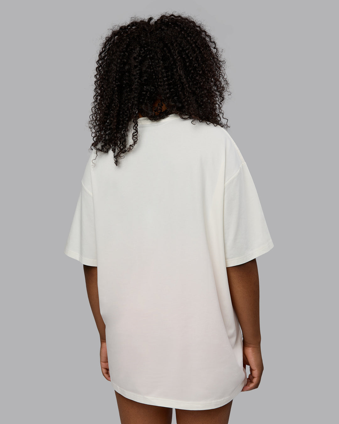 Woman wearing Unisex Just Keep Running FLXCotton Tee Oversize - Off White-Vibrant Orange