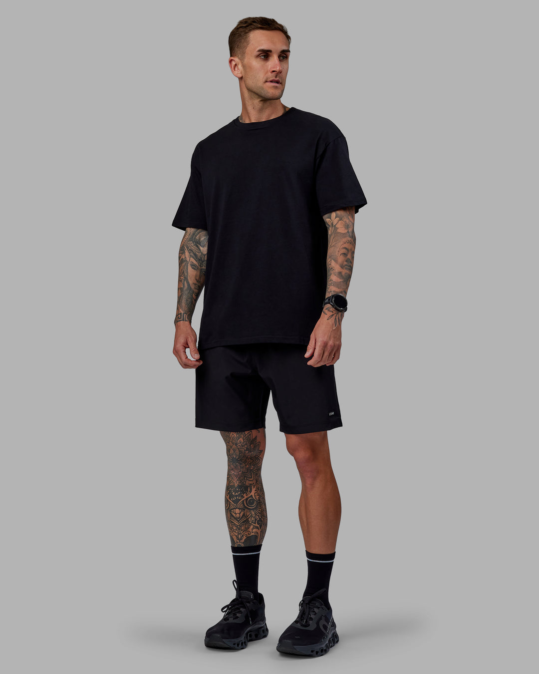 Man wearing Unisex Keep On Running FLXCotton Oversize Tee - Black-White