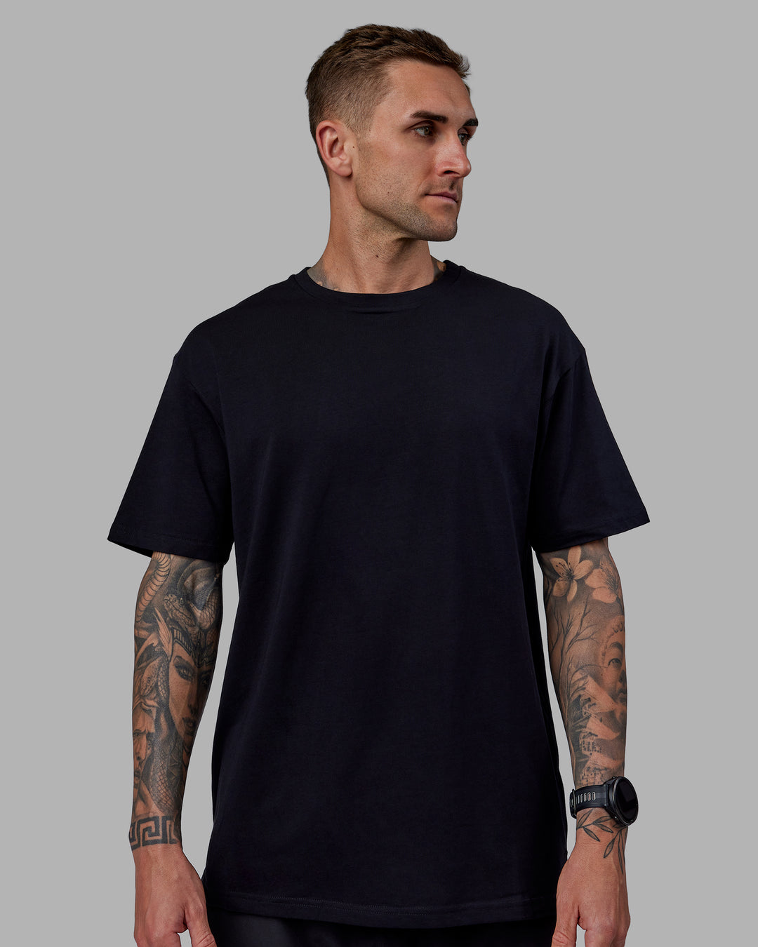 Man wearing Unisex Keep On Running FLXCotton Oversize Tee - Black-White