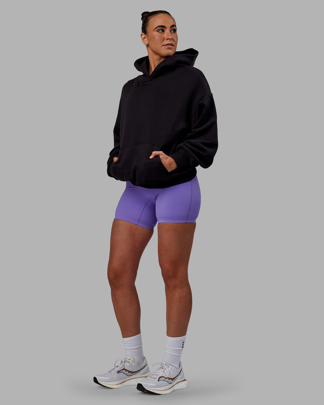 Woman wearing Unisex Keep on Running Hoodie Oversize - Black-White