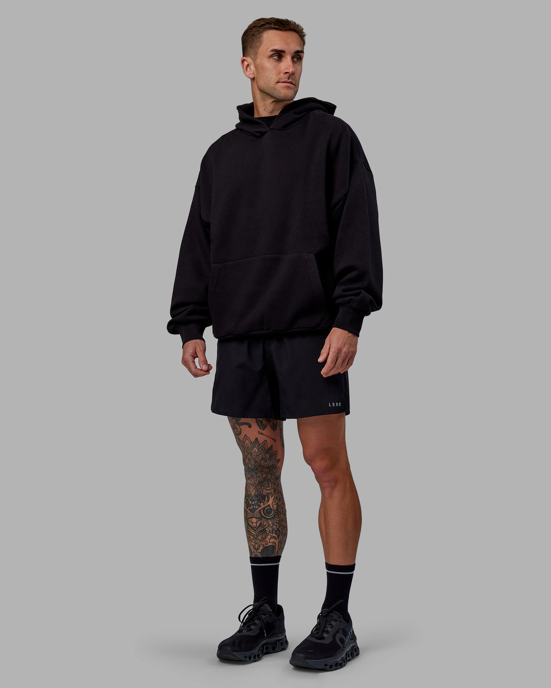 Man wearing Unisex Keep on Running Hoodie Oversize - Black-White