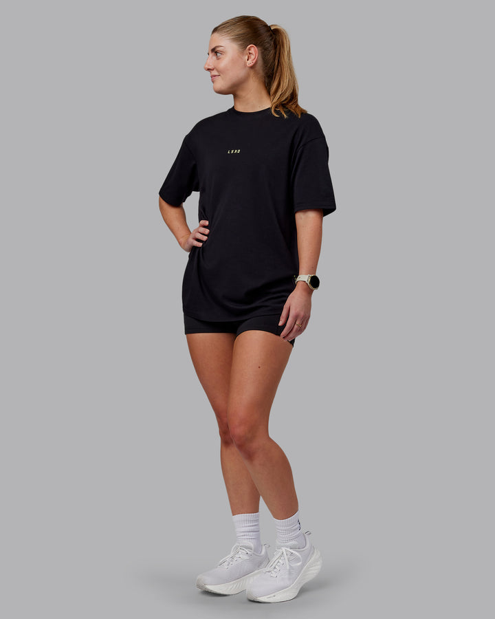 Woman wearing Unisex Leg It FLXCotton Tee Oversize - Black-Volt
