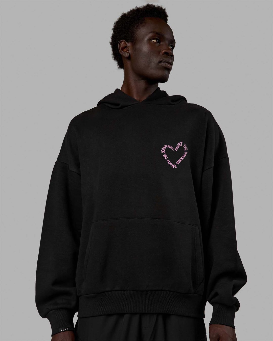 Man wearing Unisex Love The Process Oversize Hoodie - Black-Bubble Gum