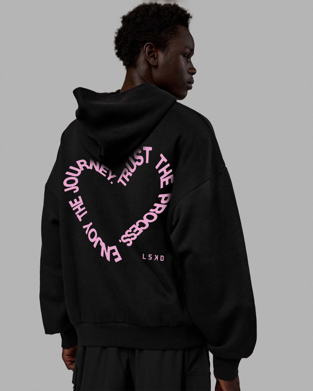 Man wearing Unisex Love The Process Oversize Hoodie - Black-Bubble Gum