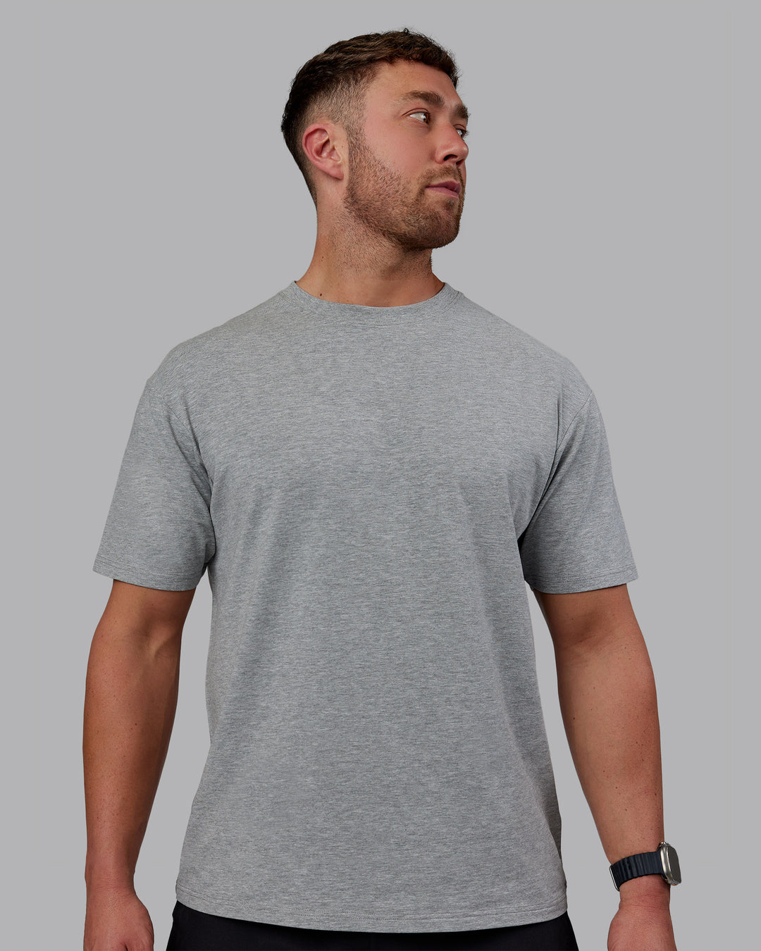 Man wearing Unisex Love The Run FLXCotton Tee Oversize - Light Grey Marl-Black