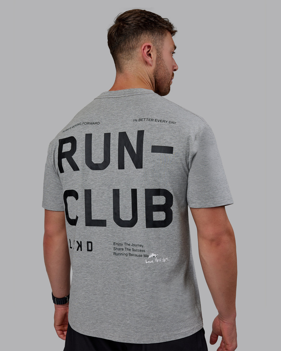 Man wearing Unisex Love The Run FLXCotton Tee Oversize - Light Grey Marl-Black