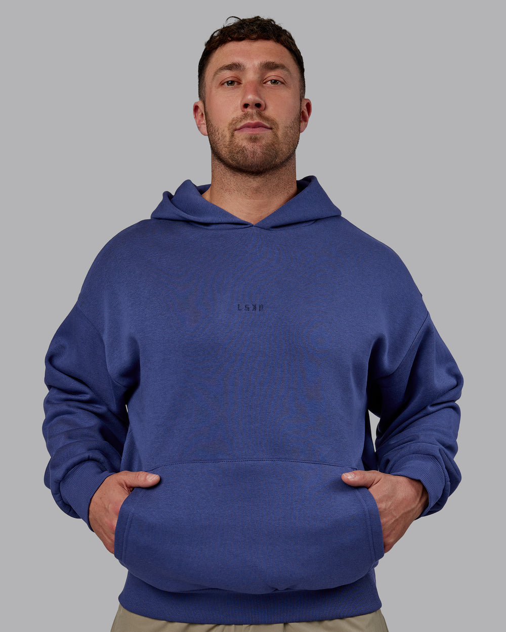 Man wearing Unisex MVP Hoodie Oversize - Future Dusk