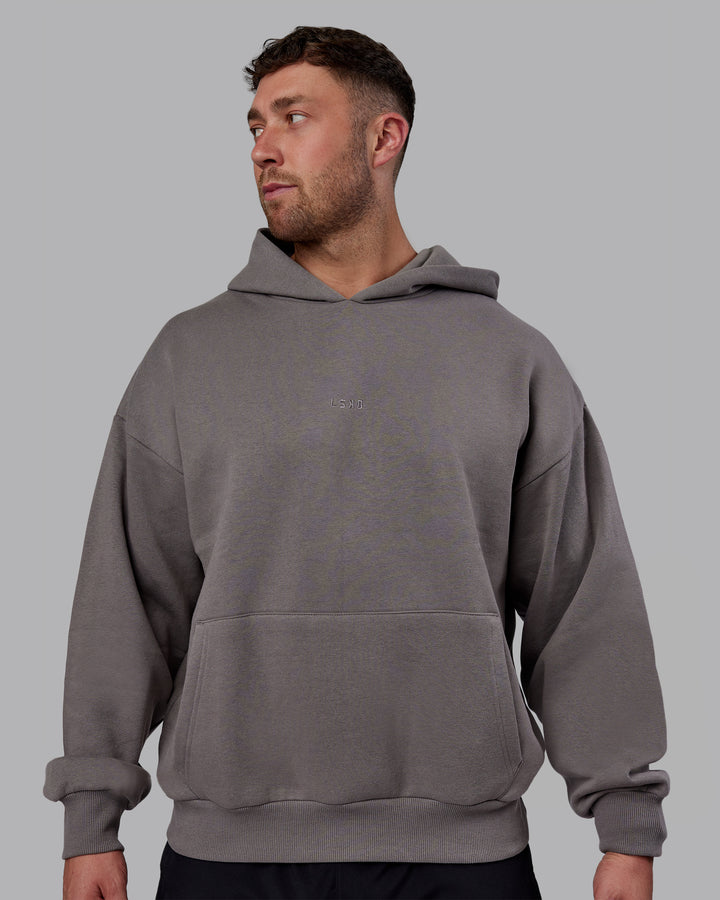 Man wearing Unisex MVP Hoodie Oversize - Storm Front
