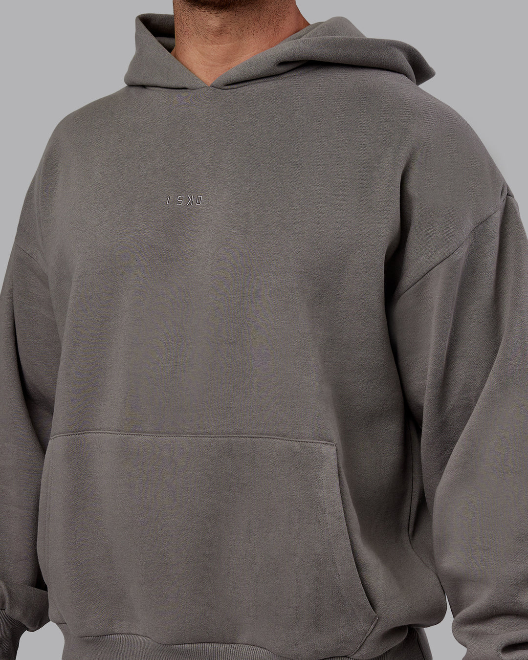 Man wearing Unisex MVP Hoodie Oversize - Storm Front