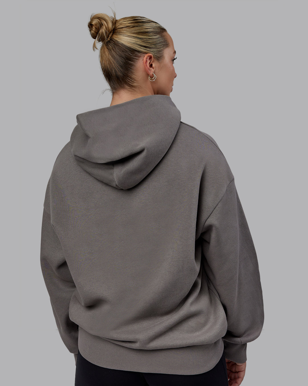 Woman wearing Unisex MVP Hoodie Oversize - Storm Front