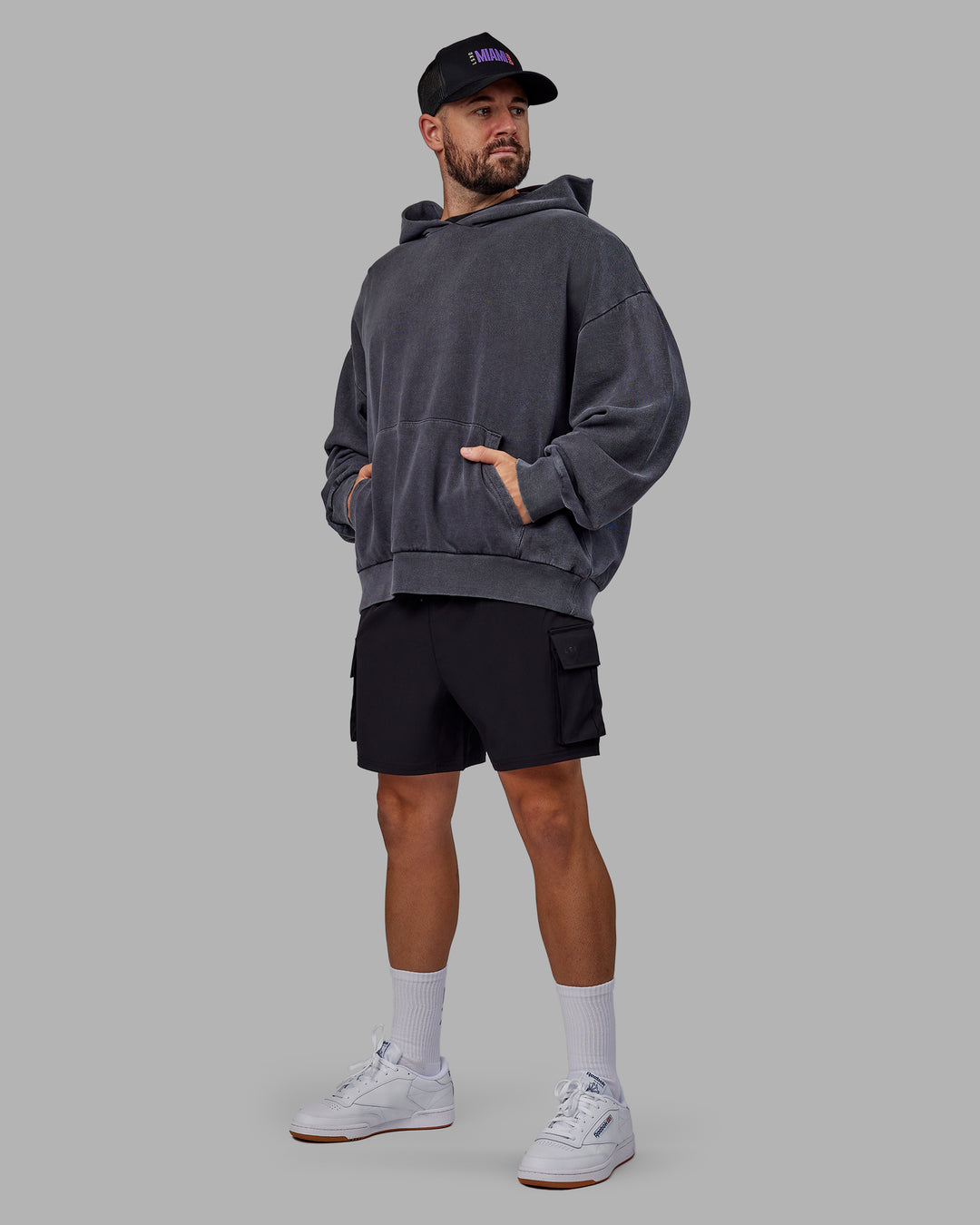 Man wearing Unisex Miami25 Washed Hoodie Oversize - Black