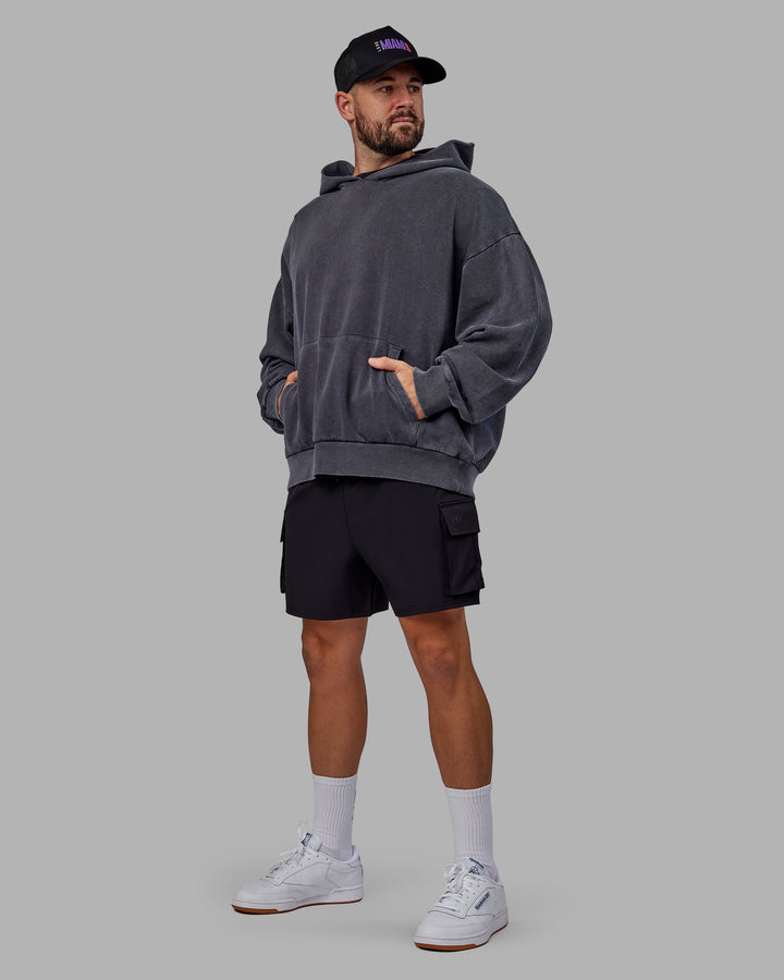 Man wearing Unisex Miami25 Washed Hoodie Oversize - Black
