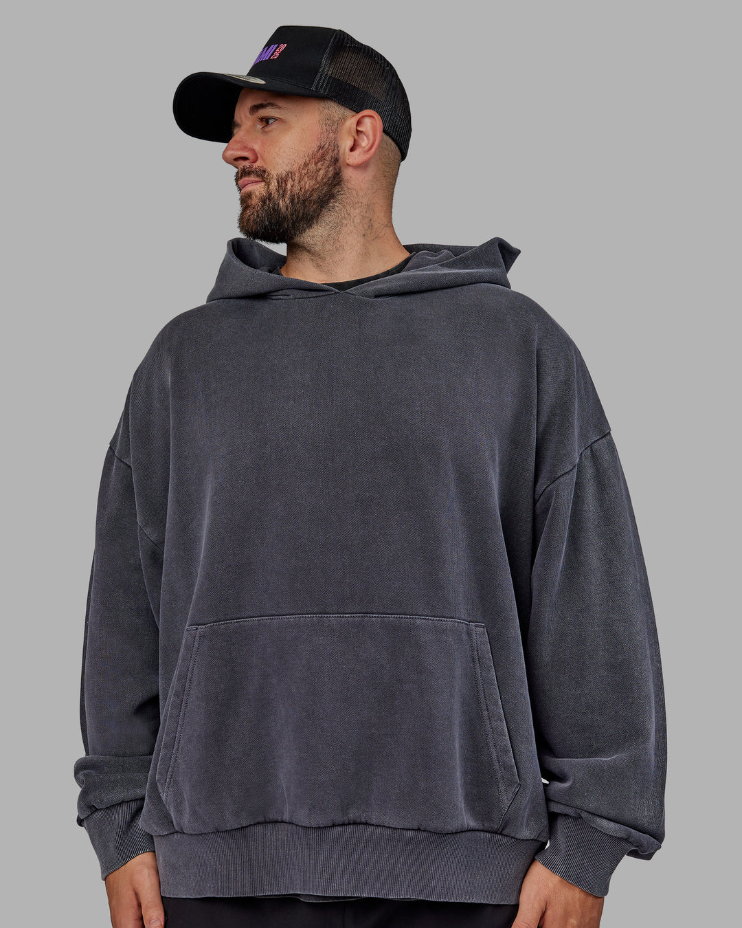 Man wearing Unisex Miami25 Washed Hoodie Oversize - Black