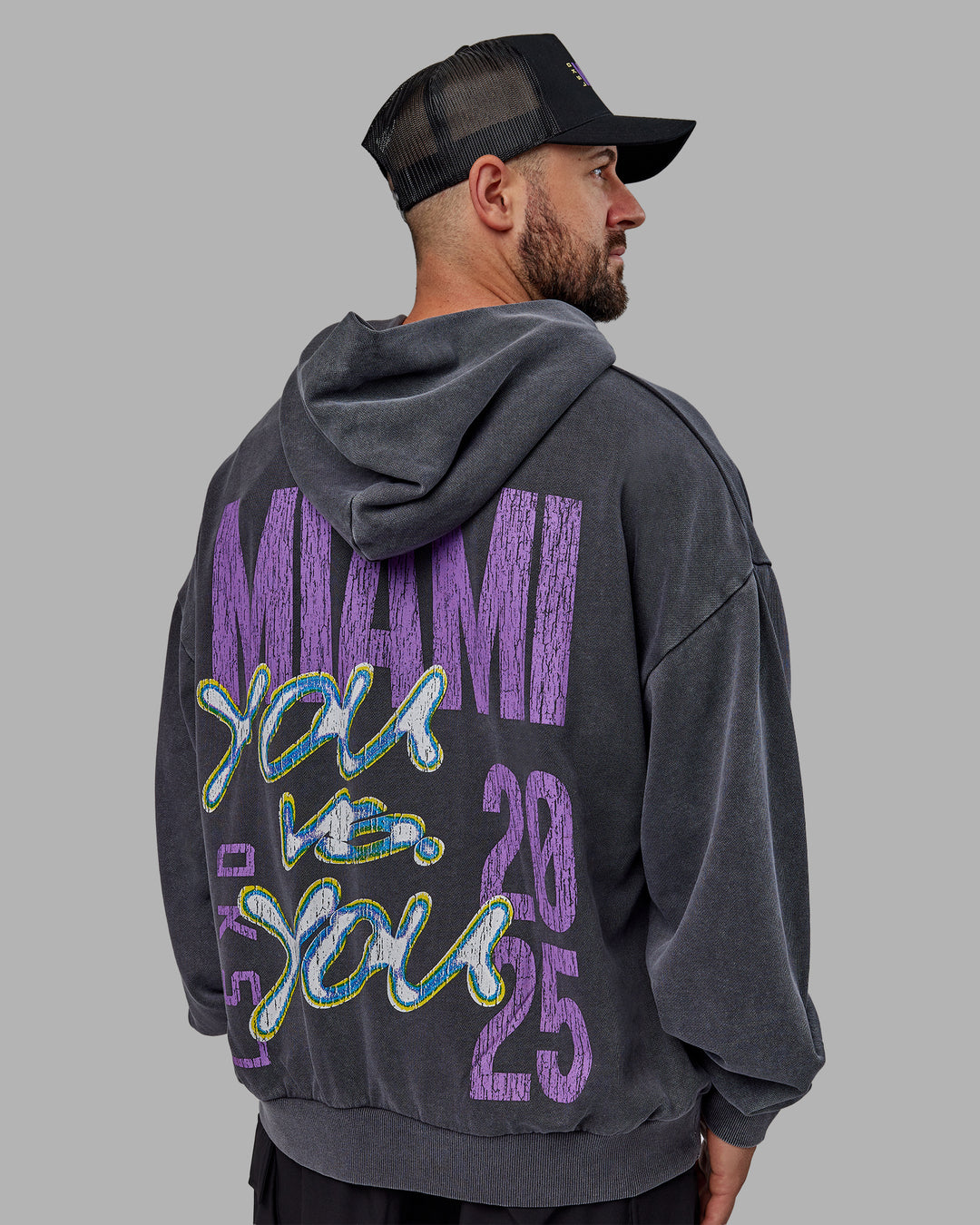 Man wearing Unisex Miami25 Washed Hoodie Oversize - Black