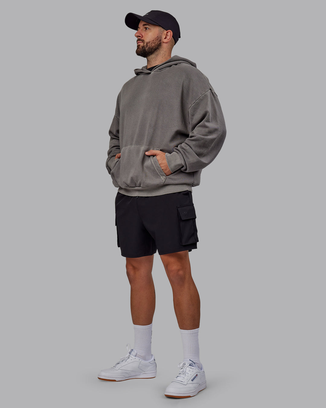 Man wearing Unisex Miami25 Washed Hoodie Oversize - Storm Front