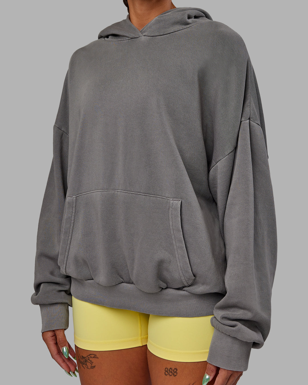 Woman wearing Unisex Miami25 Washed Hoodie Oversize - Storm Front