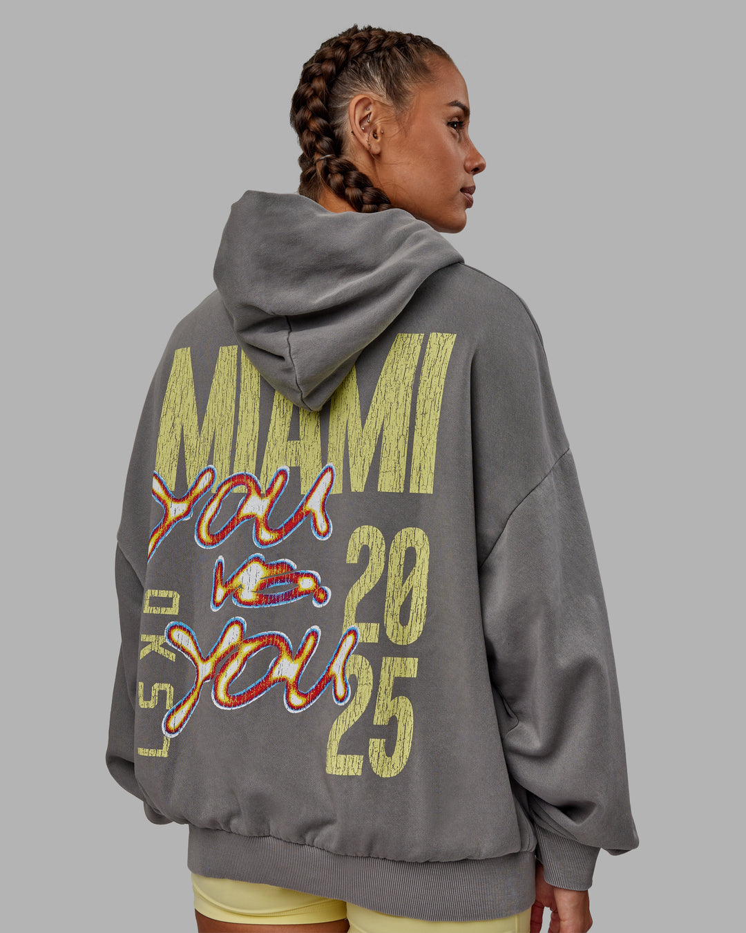 Woman wearing Unisex Miami25 Washed Hoodie Oversize - Storm Front