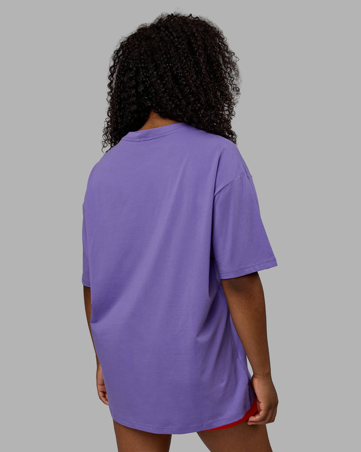 Woman wearing Unisex Motion FLXCotton Tee Oversize - Dahlia Purple-Vibrant Orange
