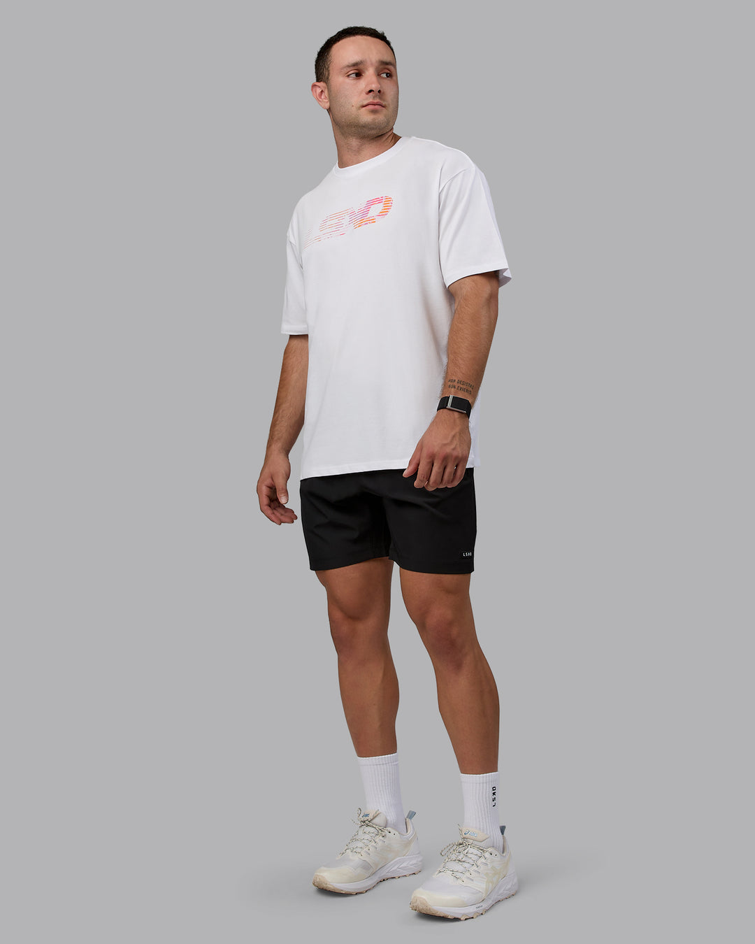 Man wearing Unisex Motion FLXCotton Tee Oversize - White-React Print