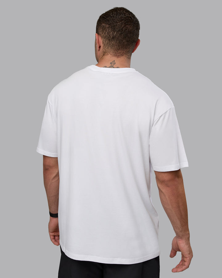 Man wearing Unisex Motion FLXCotton Tee Oversize - White-React Print
