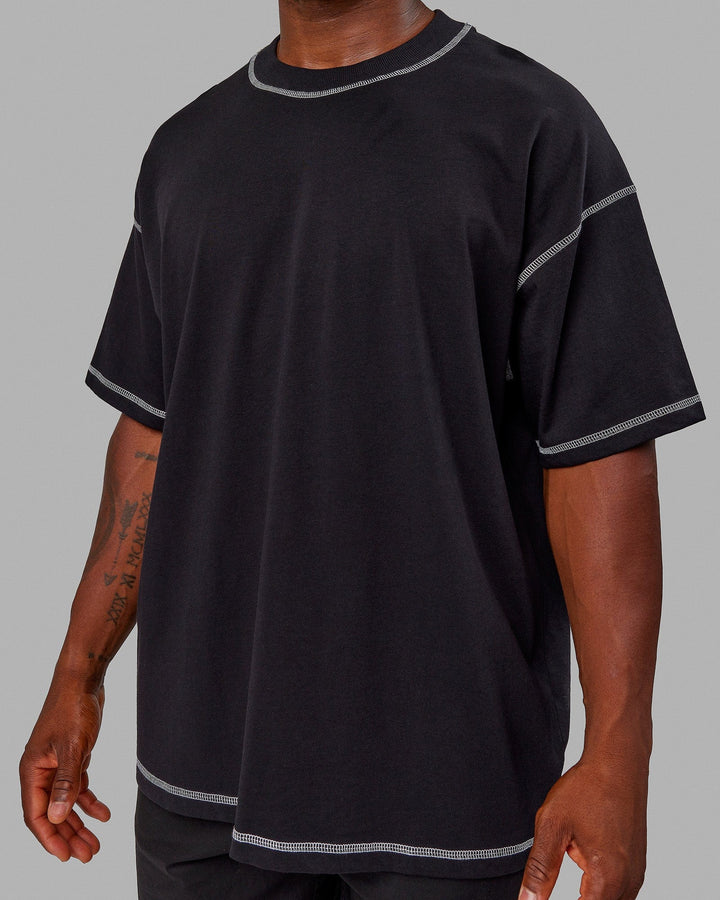 Man wearing Unisex Overlock Ultra-Heavyweight Tee Oversize - Black-White
