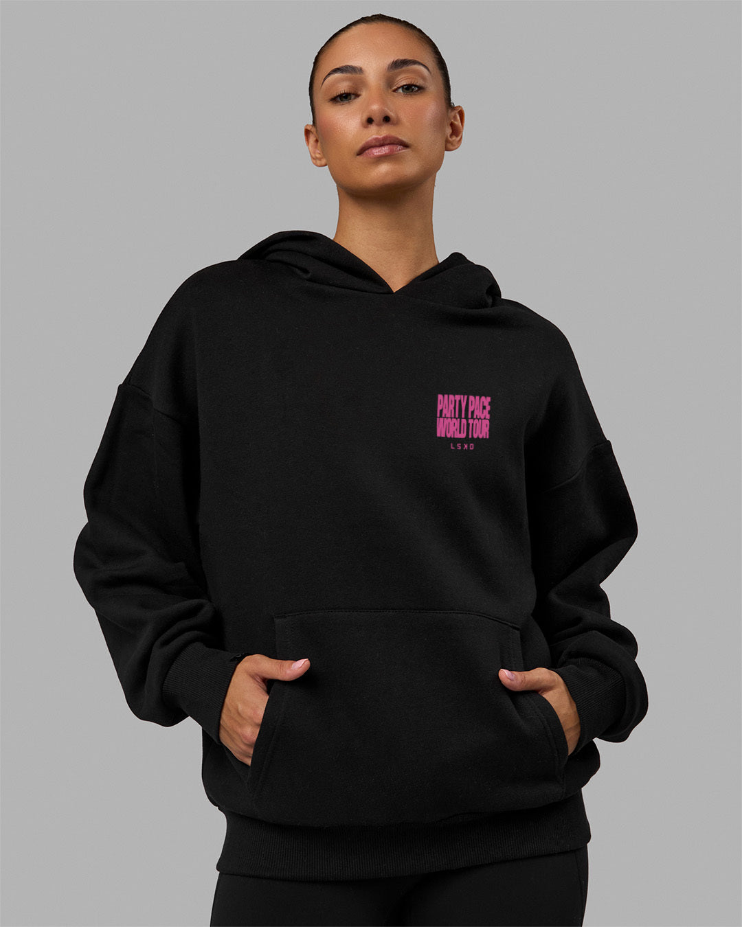 Woman wearing Unisex Party Pace Hoodie Oversize - Black-Pink