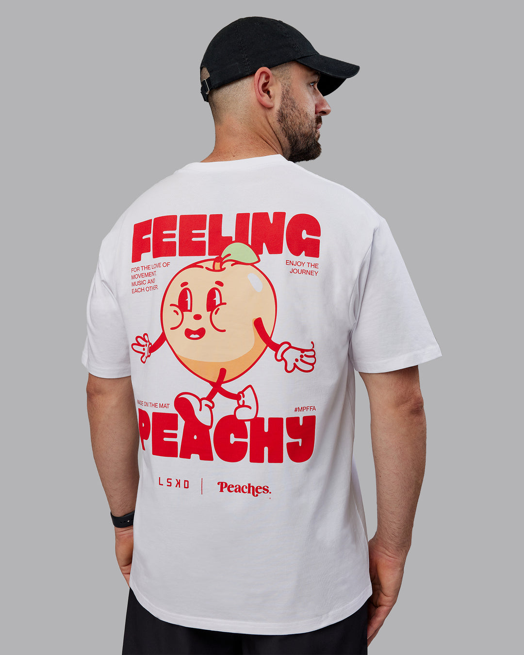 Man wearing Peaches Pilates x LSKD FLXCotton Tee Oversize - White