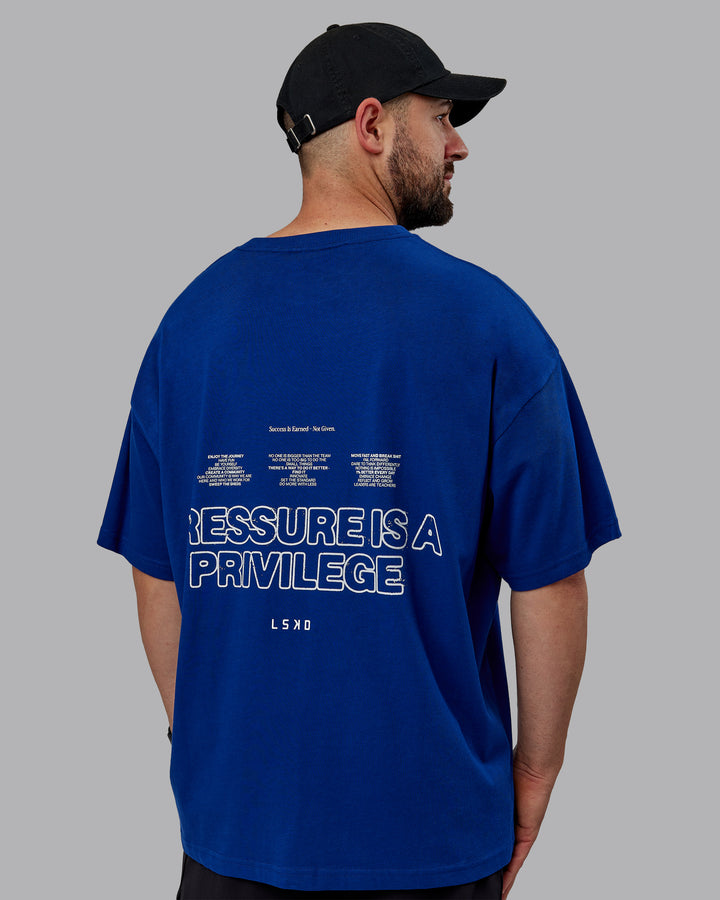 Man wearing Unisex Pressure Heavyweight Tee Oversize - Midnight Blue-White
