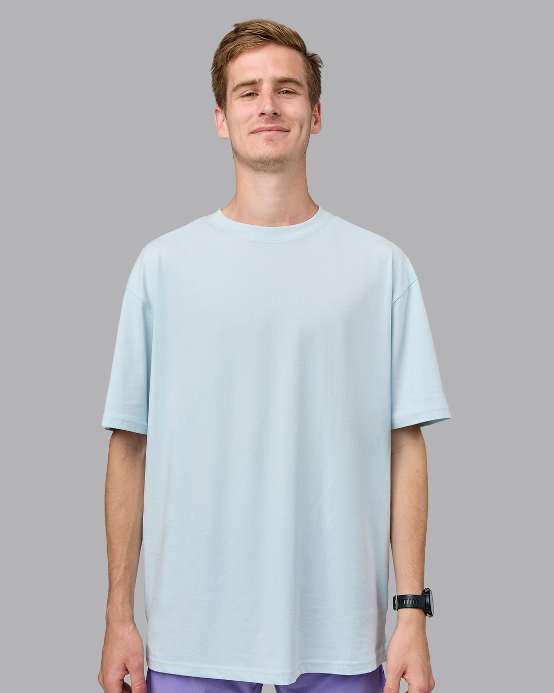 Man wearing Unisex Push Boundaries FLXCotton Tee Oversize - Light Cyan-White