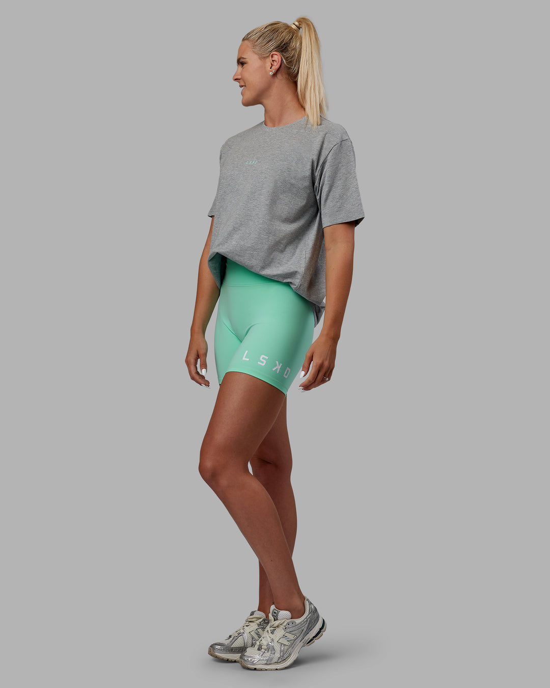 Woman wearing Unisex Resilient FLXCotton Tee - Light Grey Marl-Ice Green