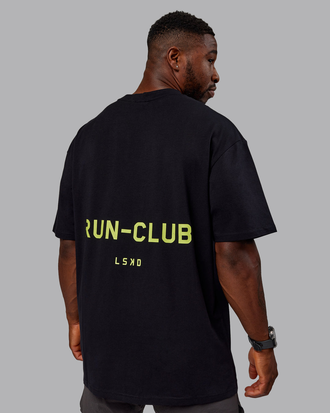 Man wearing Unisex RUN CLUB FLXCotton Tee Oversize - Black-Vol