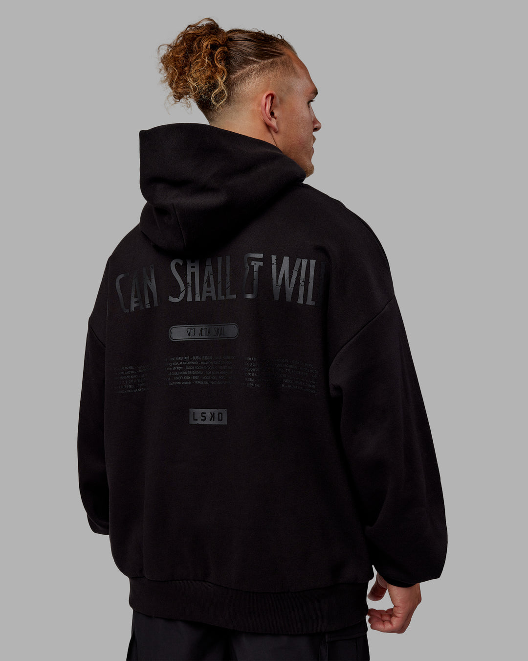 Man wearing Sara Unisex Hoodie Oversize - Black-Black