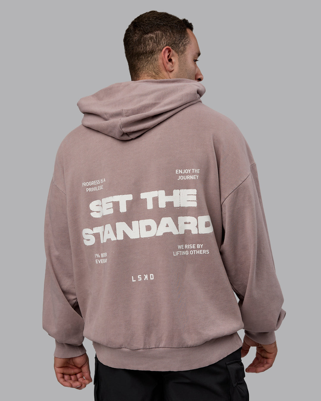 Man wearing Unisex Washed Set the Standard Hoodie Oversize - Greyish Purple-Off White