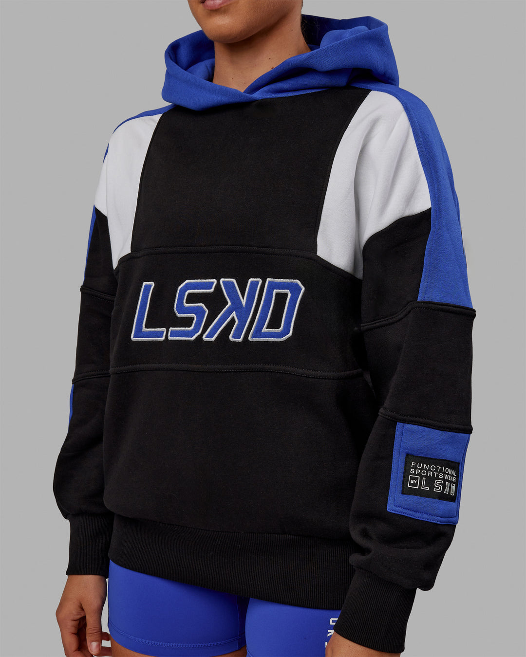 Woman wearing Unisex Slam Hoodie Oversize - Black-Power Cobalt