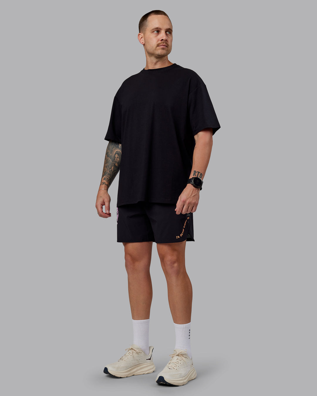 Man wearing Unisex So Cal 24 FLXCotton Tee Oversize - Black-Beacon Orange