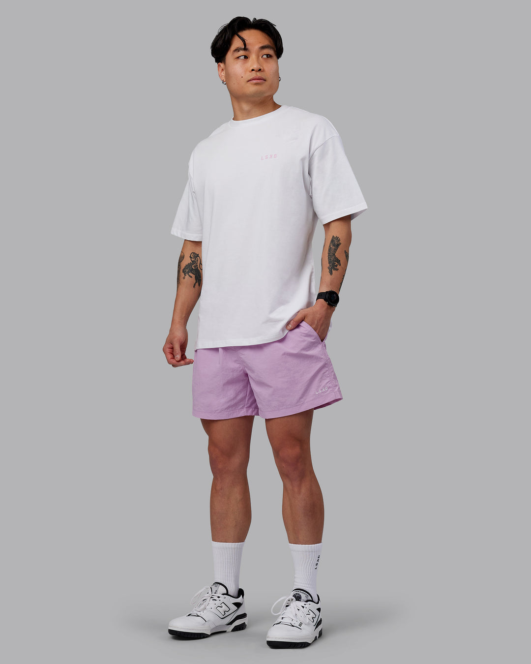 Man wearing Unisex Strike Through FLXCotton Tee Oversize - White-Bubblegum