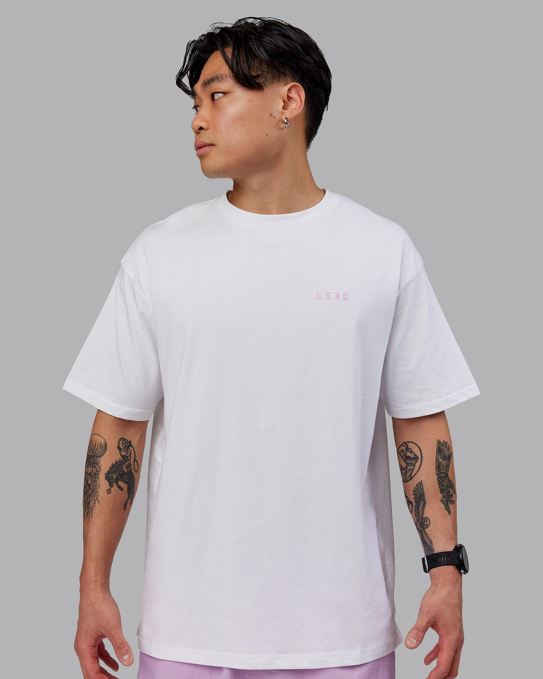 Man wearing Unisex Strike Through FLXCotton Tee Oversize - White-Bubblegum