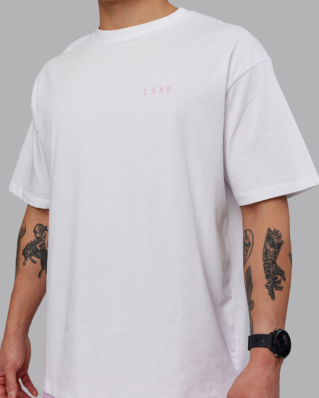 Man wearing Unisex Strike Through FLXCotton Tee Oversize - White-Bubblegum