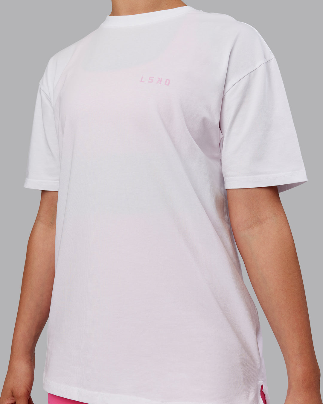 Woman wearing Unisex Strike Through FLXCotton Tee Oversize - White-Bubblegum