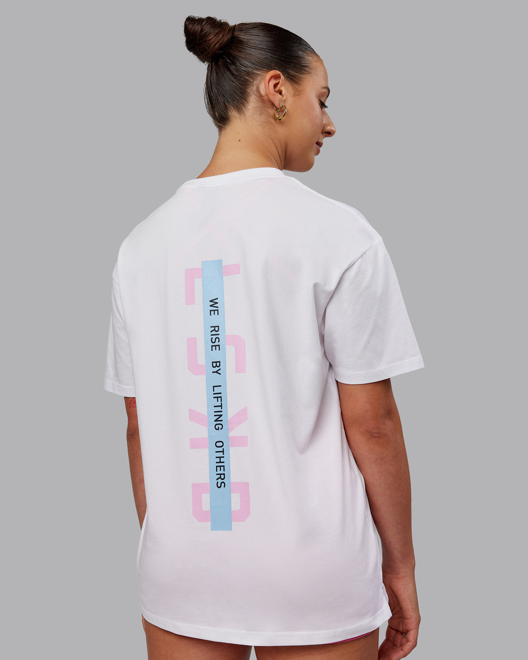 Woman wearing Unisex Strike Through FLXCotton Tee Oversize - White-Bubblegum