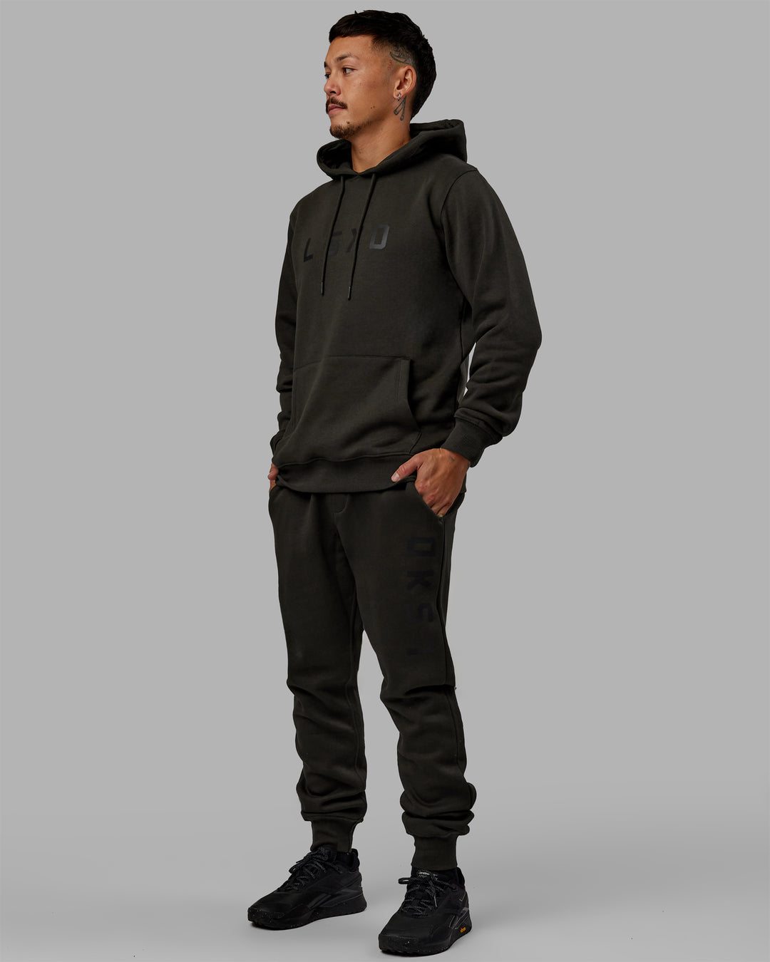 Man wearing Unisex Structure Track Pants - Pirate Black-Black