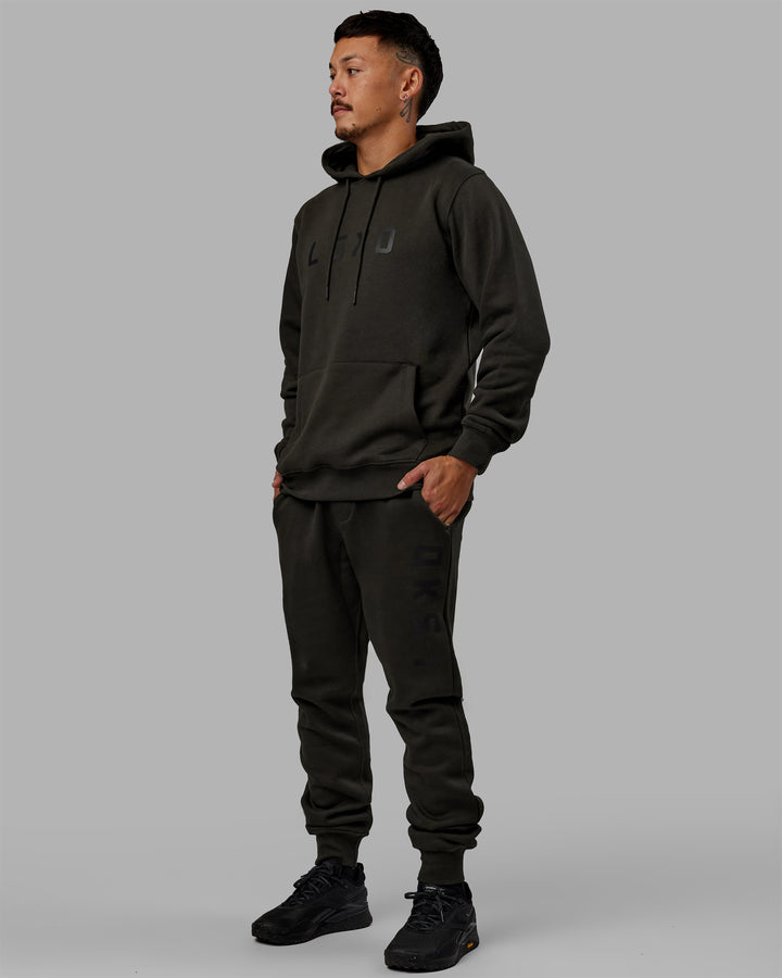 Man wearing Unisex Structure Track Pants - Pirate Black-Black
