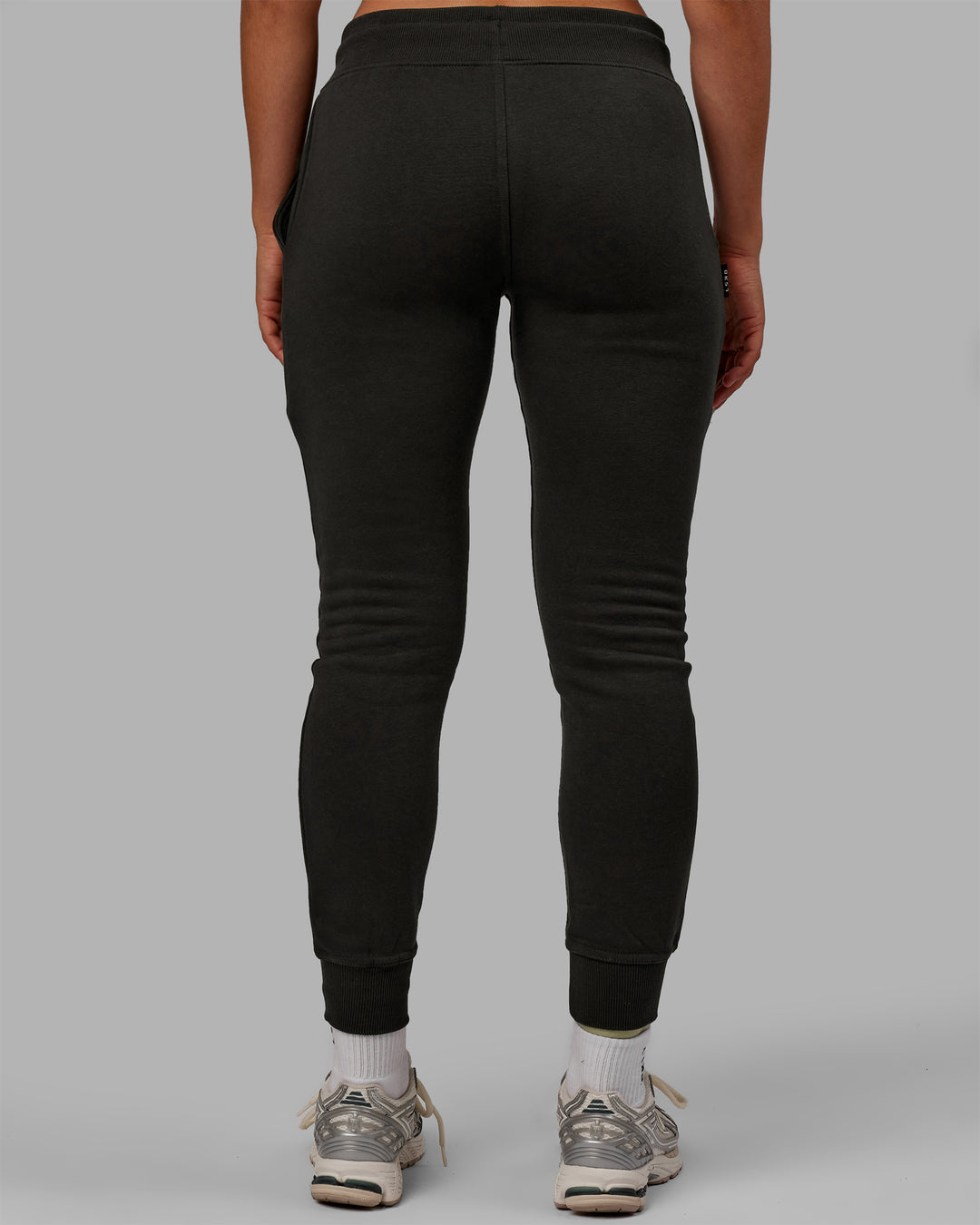 Woman wearing Unisex Structure Track Pants - Pirate Black-Black