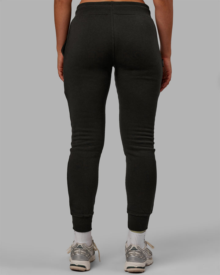 Woman wearing Unisex Structure Track Pants - Pirate Black-Black
