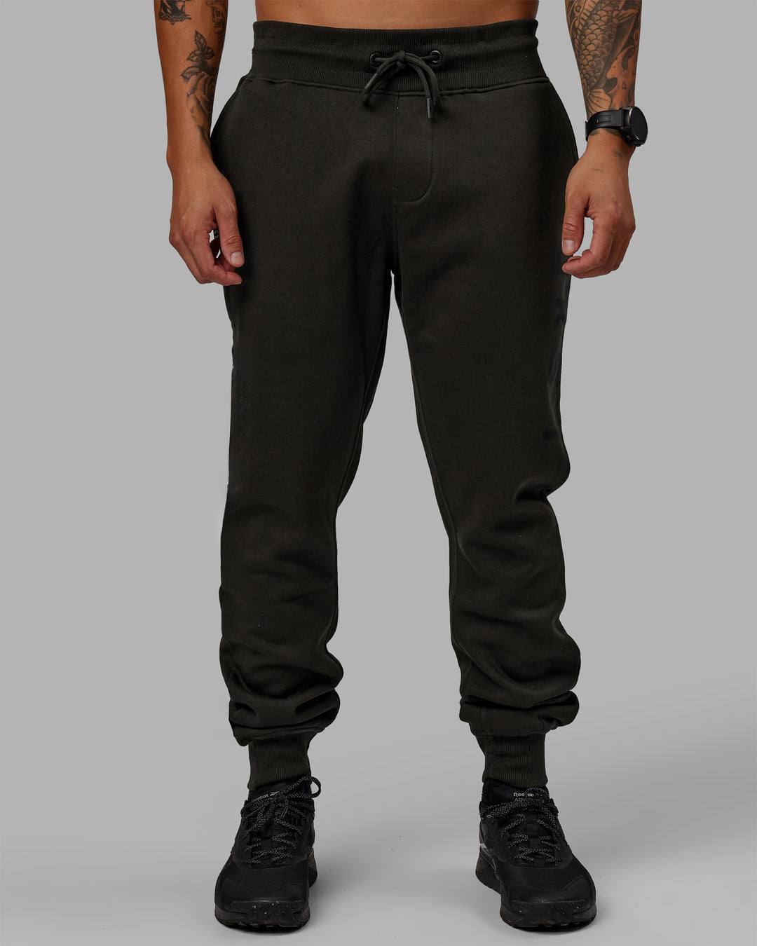 Man wearing Unisex Structure Track Pants - Pirate Black-Black