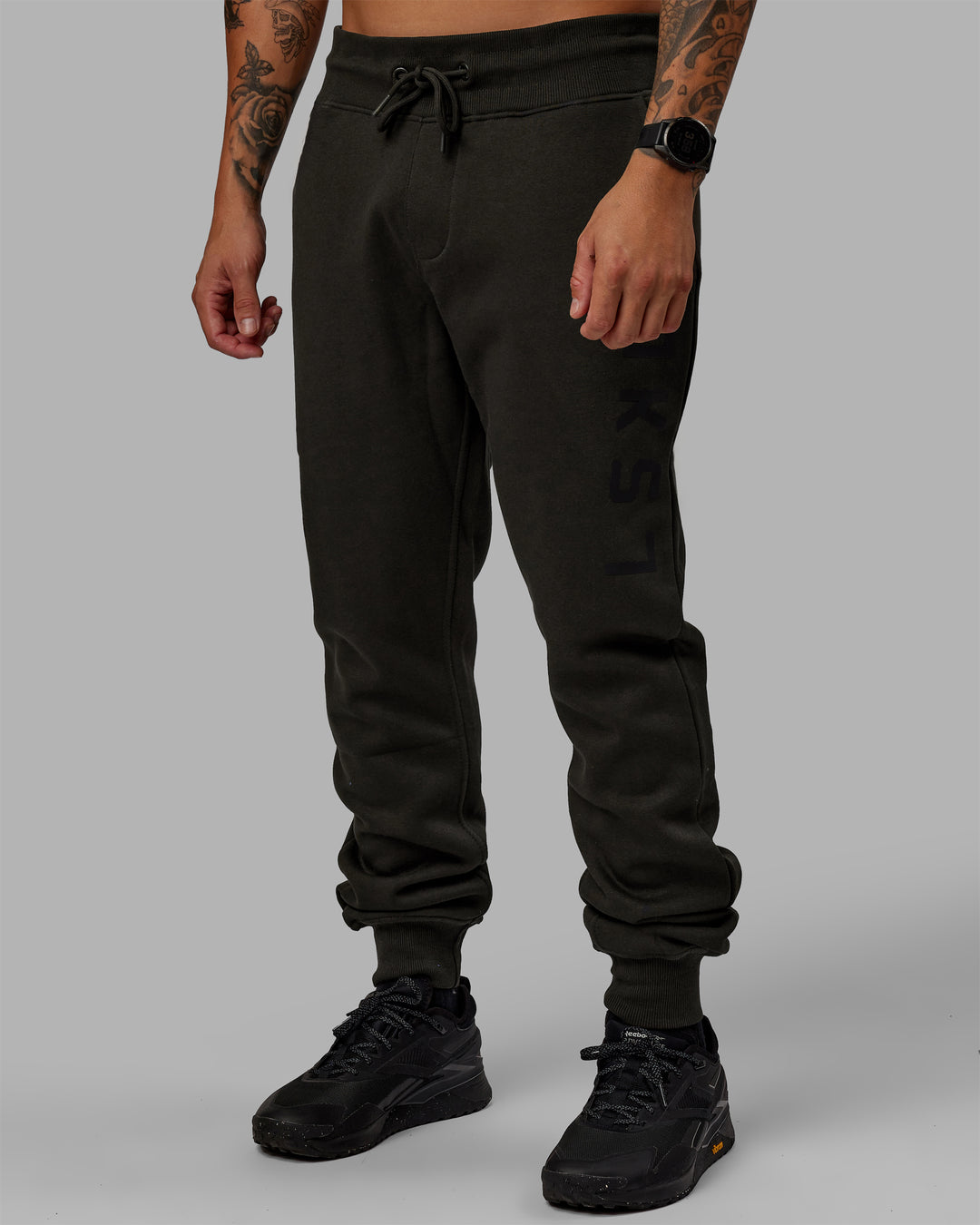 Man wearing Unisex Structure Track Pants - Pirate Black-Black