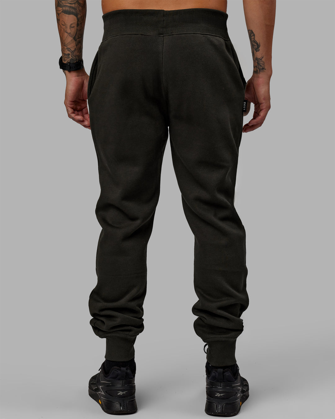 Man wearing Unisex Structure Track Pants - Pirate Black-Black