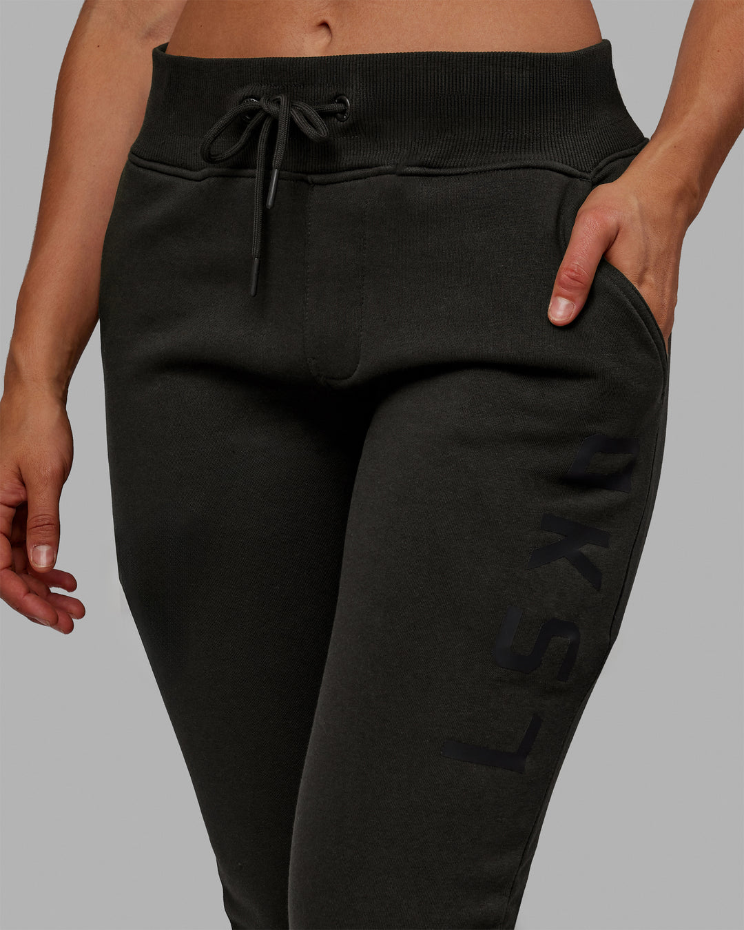 Woman wearing Unisex Structure Track Pants - Pirate Black-Black