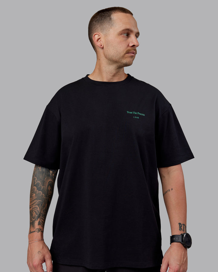 Man wearing Unisex Trust The Process 2.0 FLXCotton Tee Oversize - Black-Impact Green
